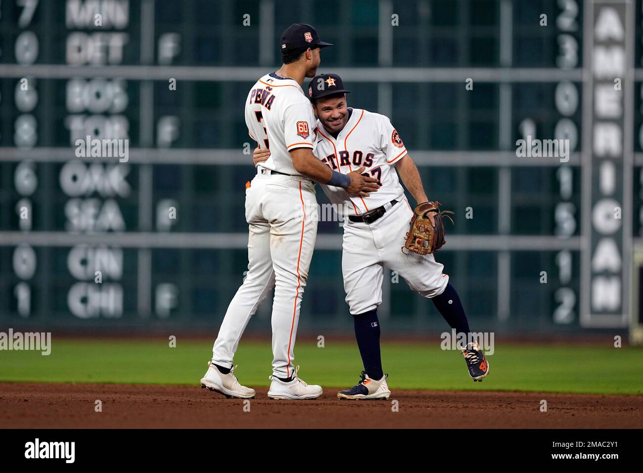 Houston Astros' Jeremy Pena (3) and Jose Altuve (27) celebrate after a  baseball game against the