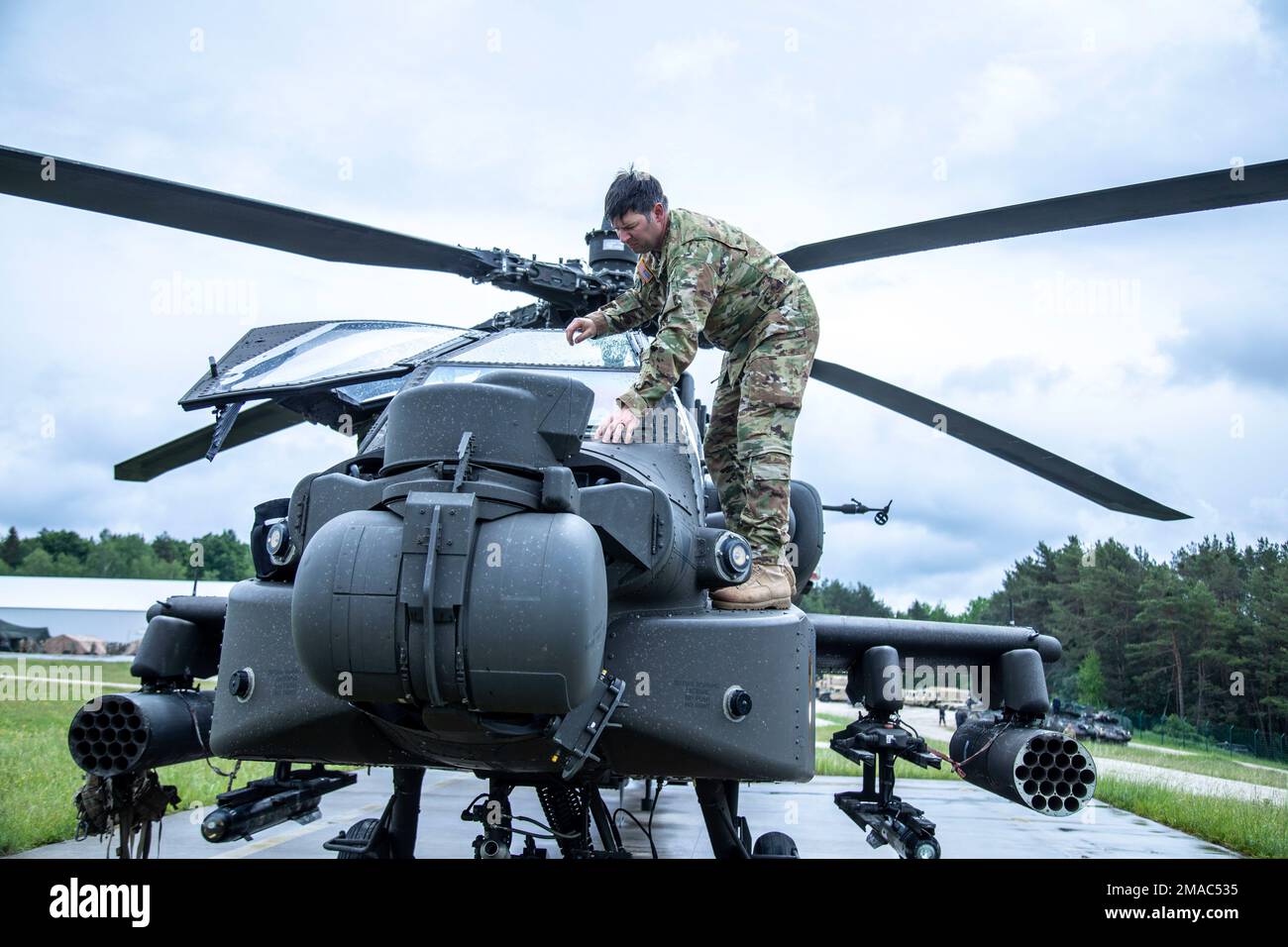 Cheif Warrant Officer 2 Durand of Bravo Troop, 7th Squadron, 17th Cavalry Regiment conducts pre-flight inspections on an AH-64 Apache helicopter during Combined Resolve XVII, Hohenfels Training Area, May 25, 2022. Combined Resolve XVII is a United States Army Europe and Africa directed, 7th Army Training Command executed training event at the Joint Multinational Readiness Center to exercise combined arms operations in a multinational environment.  The exercise features approximately 4,800 Soldiers from Belgium, Bosnia & Herzegovina, Czech Republic, Estonia, Greece, Italy, Kosovo, Lithuania, Mo Stock Photo