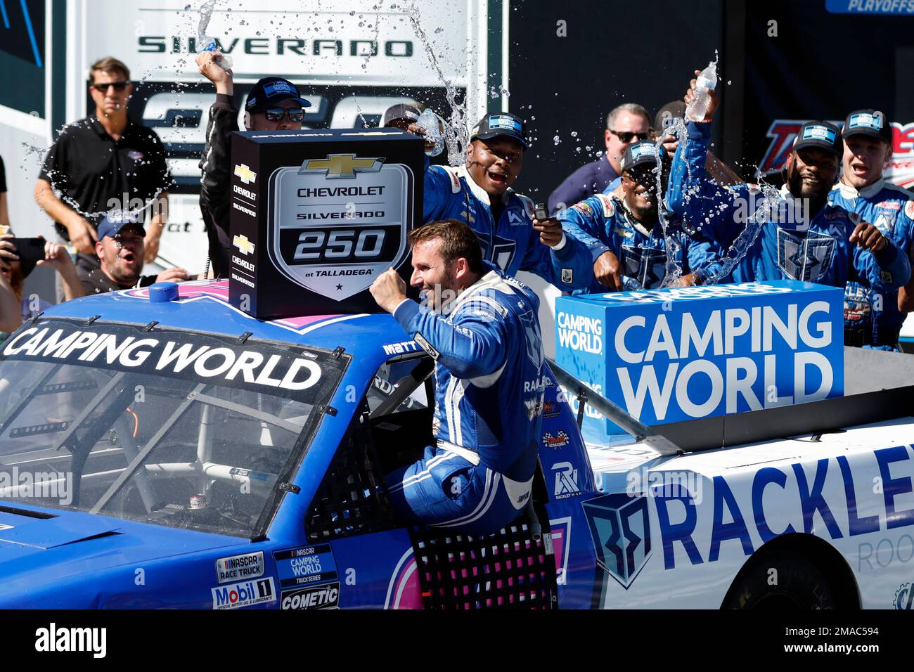 Truck Series driver Matt DiBenedetto celebrates after winning the