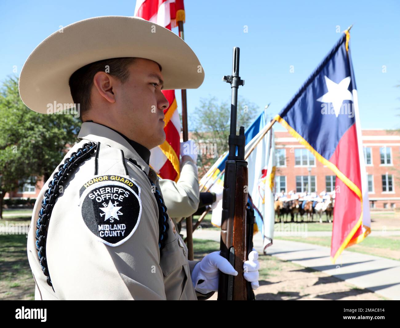 A member of the Midland County Sheriff's Office Honor Guard is shown ...