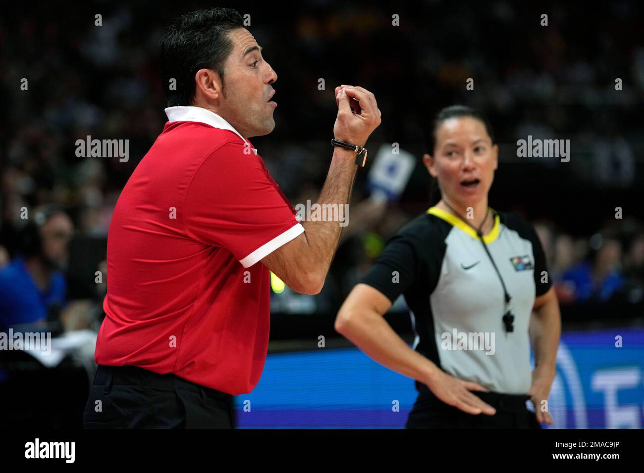 Canada's coach Víctor Lapena, left, argue with the referee during their ...