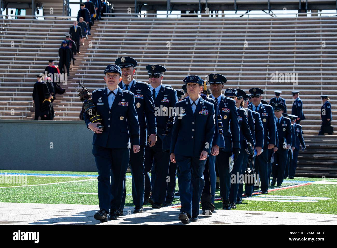 U.S. Air Force Academy -- Brigadier General Linell A. Letendre, Dean of the Faculty, leads her staff into Falcon stadium for the Class of 2022 Graduation Ceremony at the Air Force Academy in Colorado Springs, Colo., May 25, 2022. Nine-hundred-seventy cadets crossed the stage to become the Air Force/Space Force’s newest second lieutenants. (U.S. Air Force photo/Joshua Armstrong) Stock Photo