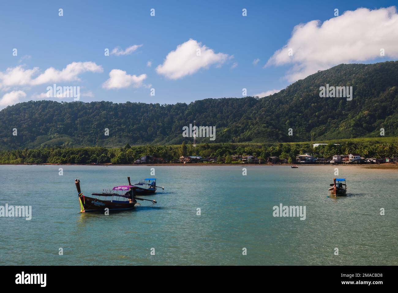 Three long-tail boats outside Koh Lanta Old Town in Ko Lanta, Krabi, Thailand. November 29, 2022. Stock Photo