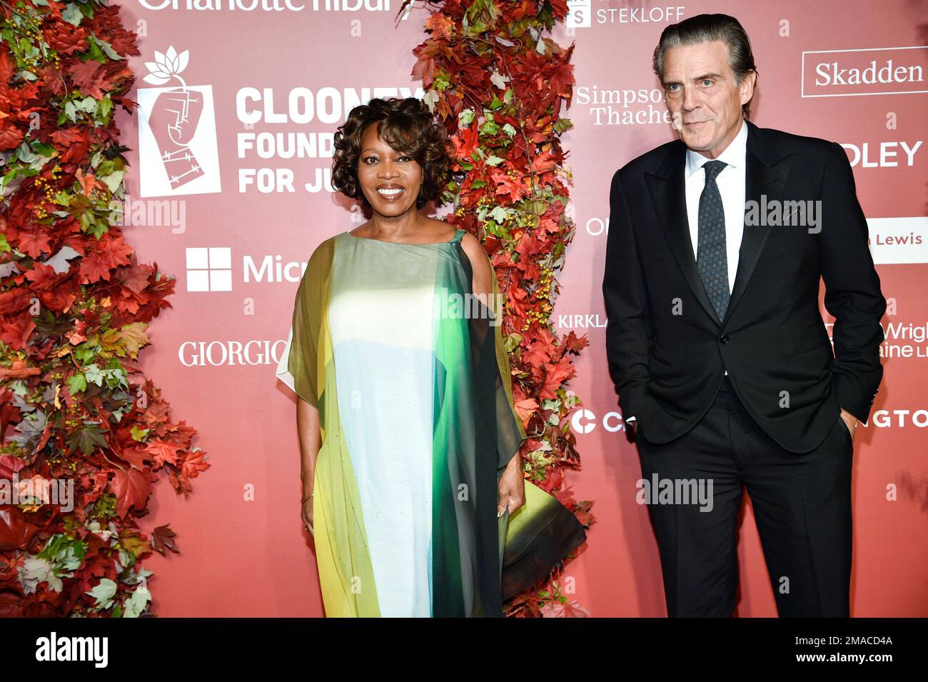 Alfre Woodard, left, and husband Roderick Spencer attend the Clooney
