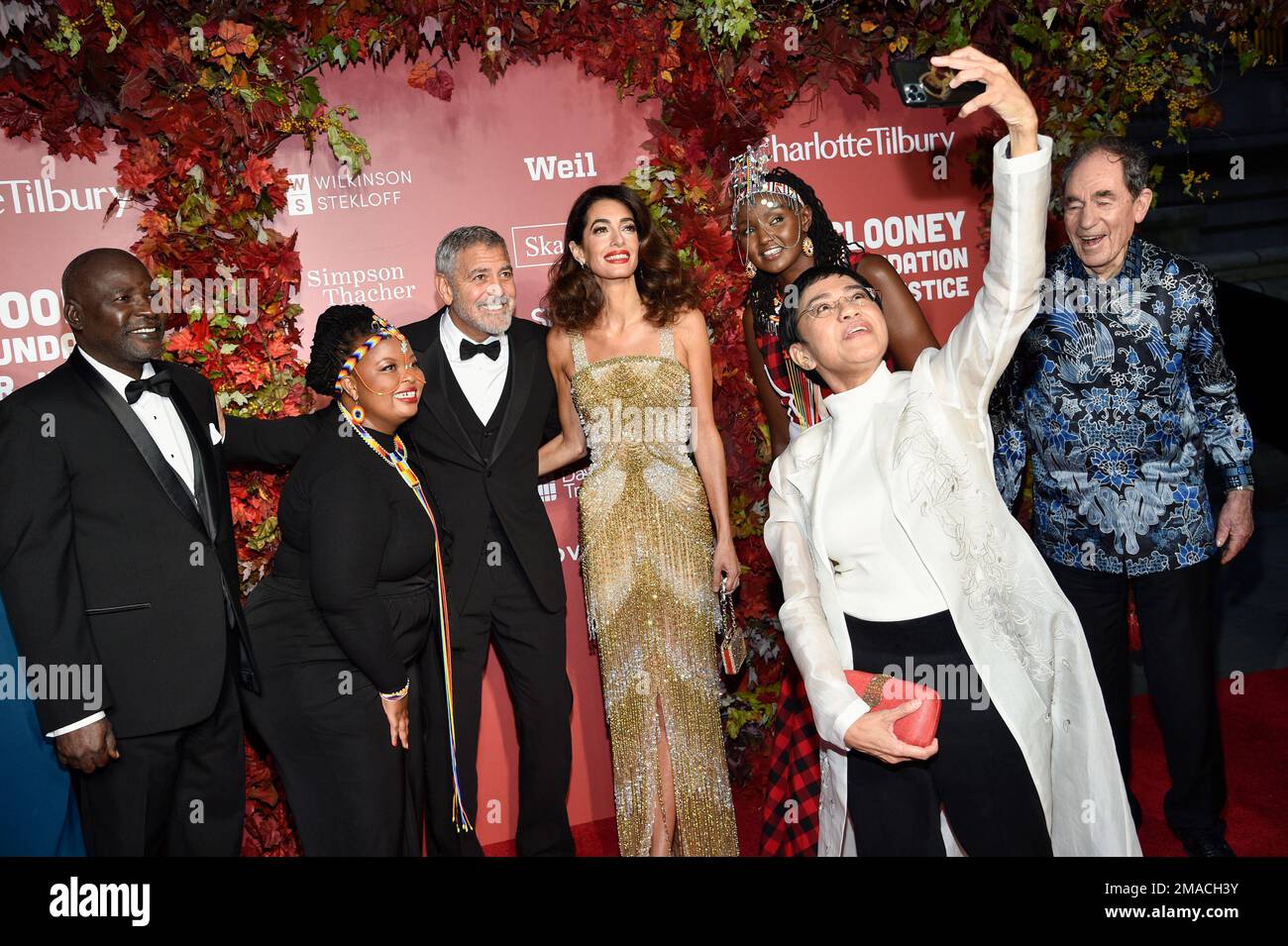 "Oumda" Alfateh Younous Haroun, left, Wanjiru Wahome, George Clooney