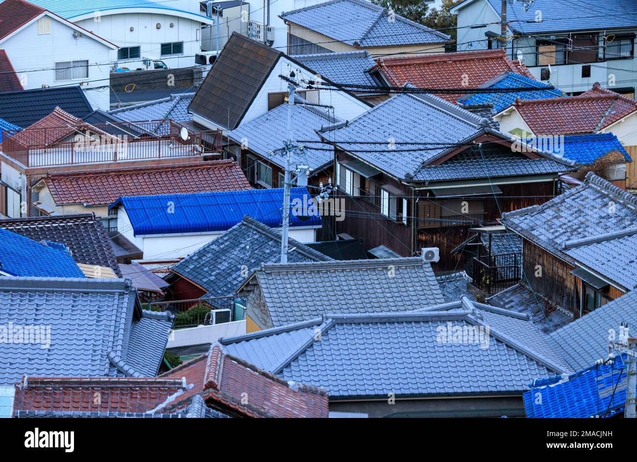 Tiled Roofs on Houses of Dense Residential Neighborhood in Japanese Town Stock Photo