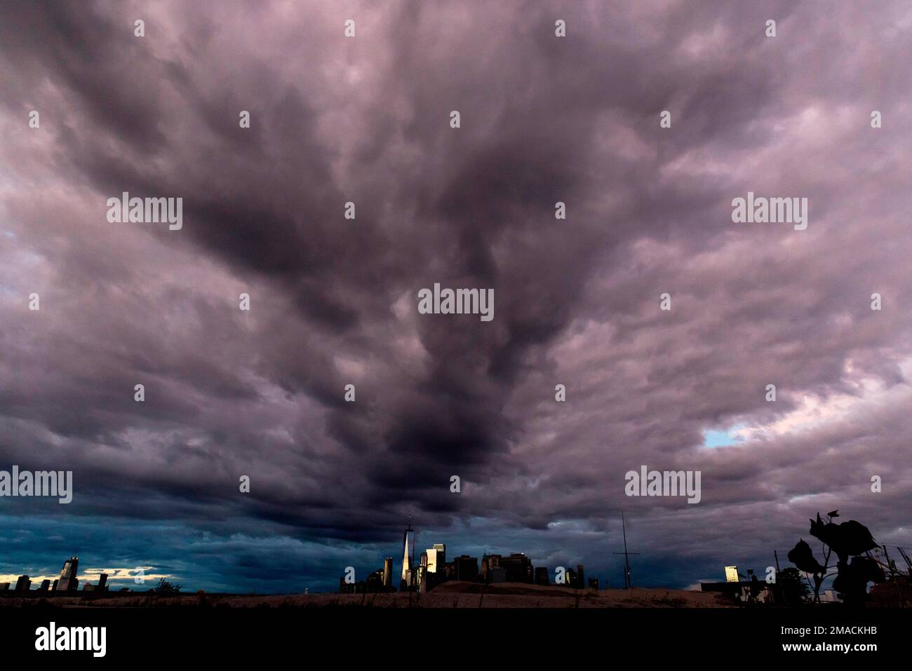 Clouds form over the New York skyline during sunset, Wednesday, Sept ...