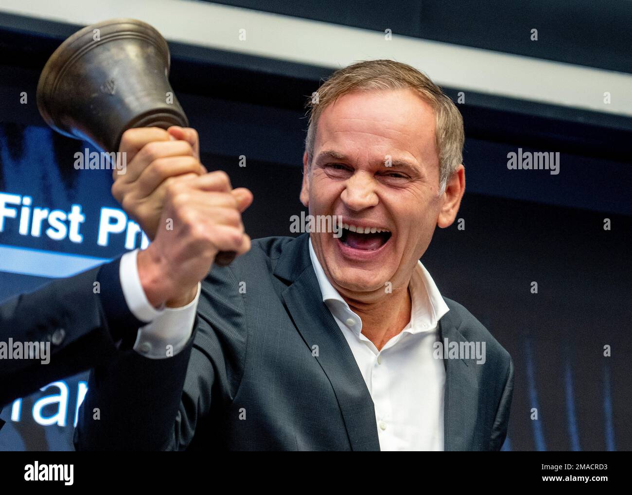 CEO of Porsche car maker Oliver Blume rings the bell during the start