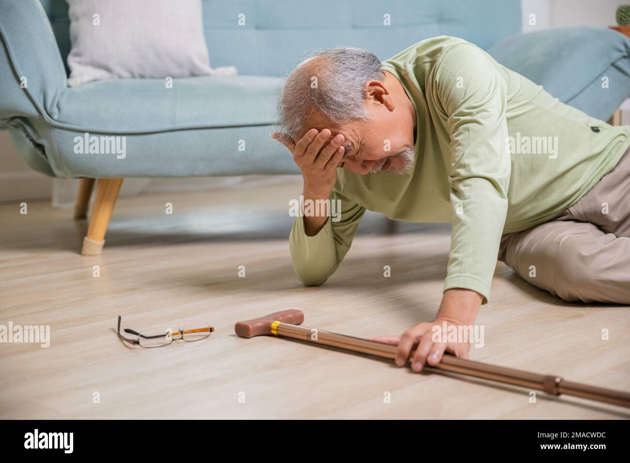 Older senior man headache lying on the floor after falling Stock Photo Alamy