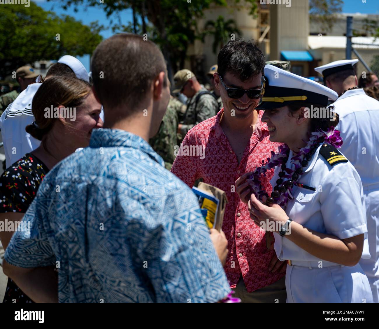 220525-N-LN285-2332 JOINT BASE PEARL HARBOR-HICKAM (May 25, 2022) --  Lt.j.g. Sabella Norton, from Merritt Island, Fla., assigned to the Virginia-class fast-attack submarine USS North Carolina (SSN 777) reunites with her family after the boat returns to Joint Base Pearl Harbor-Hickam from deployment in the 7th Fleet area of responsibility. North Carolina performed a full spectrum of operations, including anti-submarine and anti-surface warfare, during the extended seven-month, Indo-Pacific deployment. Stock Photo