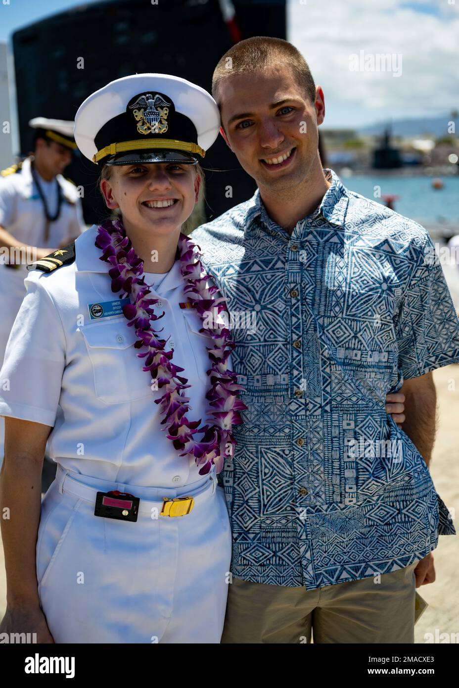 220525-N-LN285-2426 JOINT BASE PEARL HARBOR-HICKAM (May 25, 2022) -- Lt.j.g. Lisa Urness, from Oswego, Ore., assigned to the Virginia-class fast-attack submarine USS North Carolina (SSN 777) reunites with her family after the boat returns to Joint Base Pearl Harbor-Hickam from deployment in the 7th Fleet area of responsibility. North Carolina performed a full spectrum of operations, including anti-submarine and anti-surface warfare, during the extended seven-month, Indo-Pacific deployment. Stock Photo