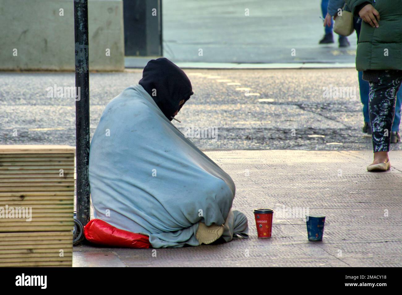 homeless man begging in Glasgow, Scotland, UK Stock Photo