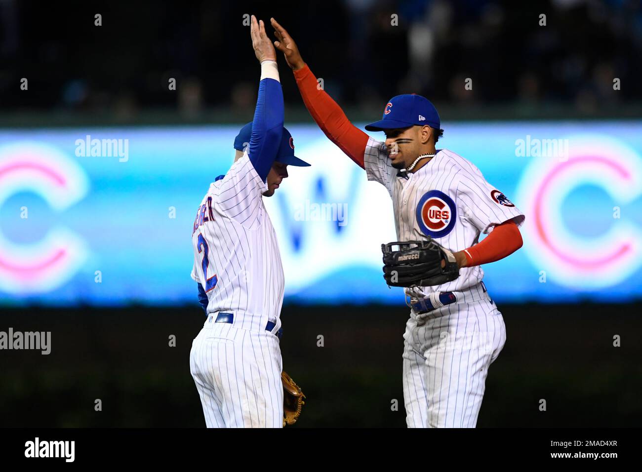 Chicago Cubs' Ben DeLuzio, right, celebrates after his run scored