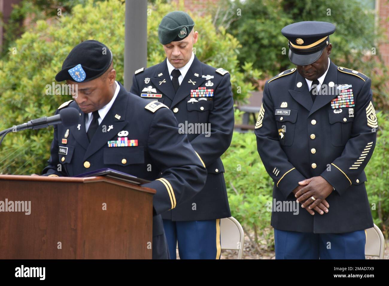 Chaplain (Capt.) Lemuel E. Pearsall, Jr., flanked by Lt. Col. Calvin