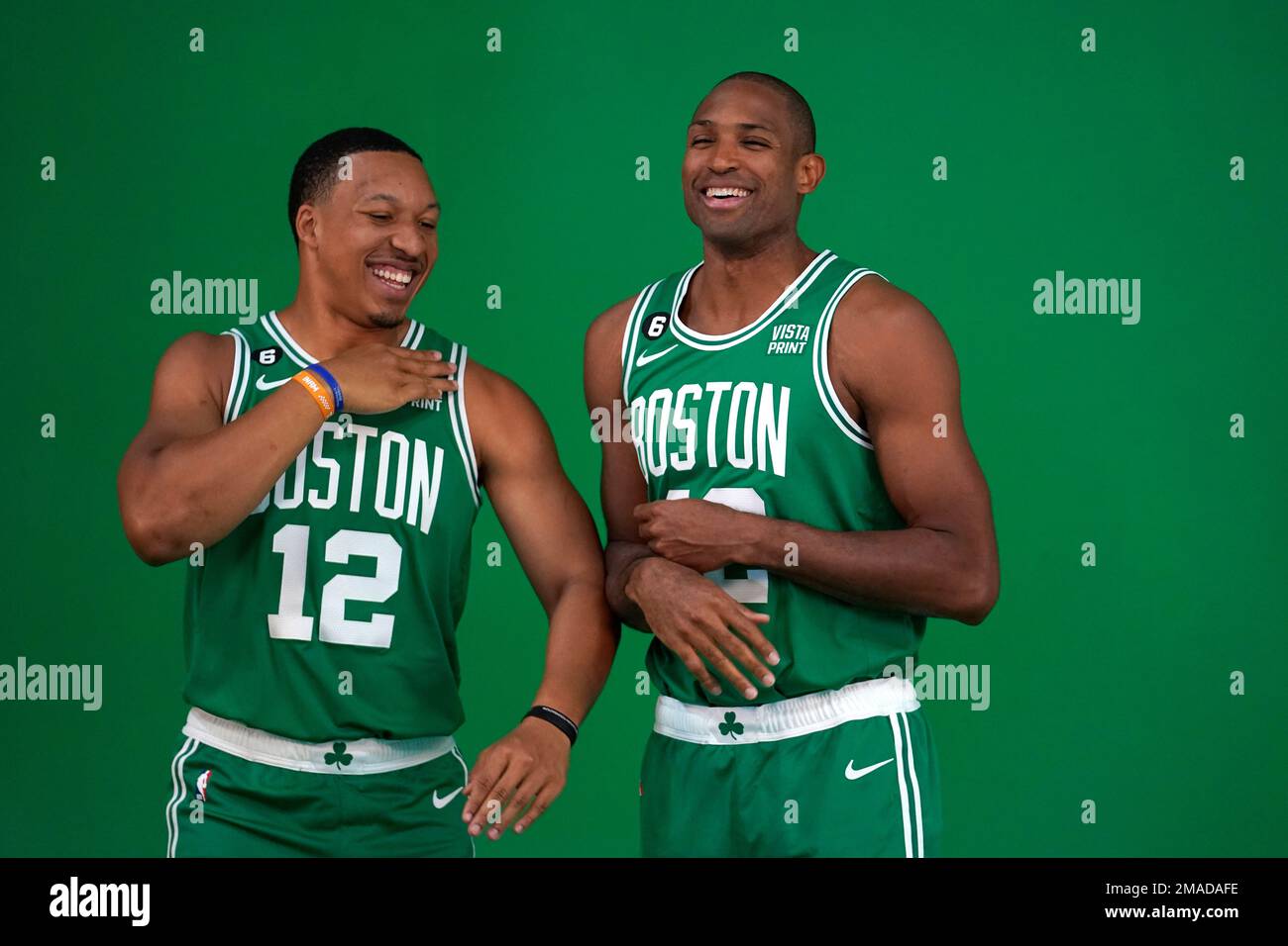 Boston Celtics forward Grant Williams, left, jokes with center Al Horford, right, as the basketball players stand for photos during Boston Celtics Media Day, Monday, Sept. 26, 2022, in Canton, Mass. (AP Photo/Steven Senne) Stock Photo