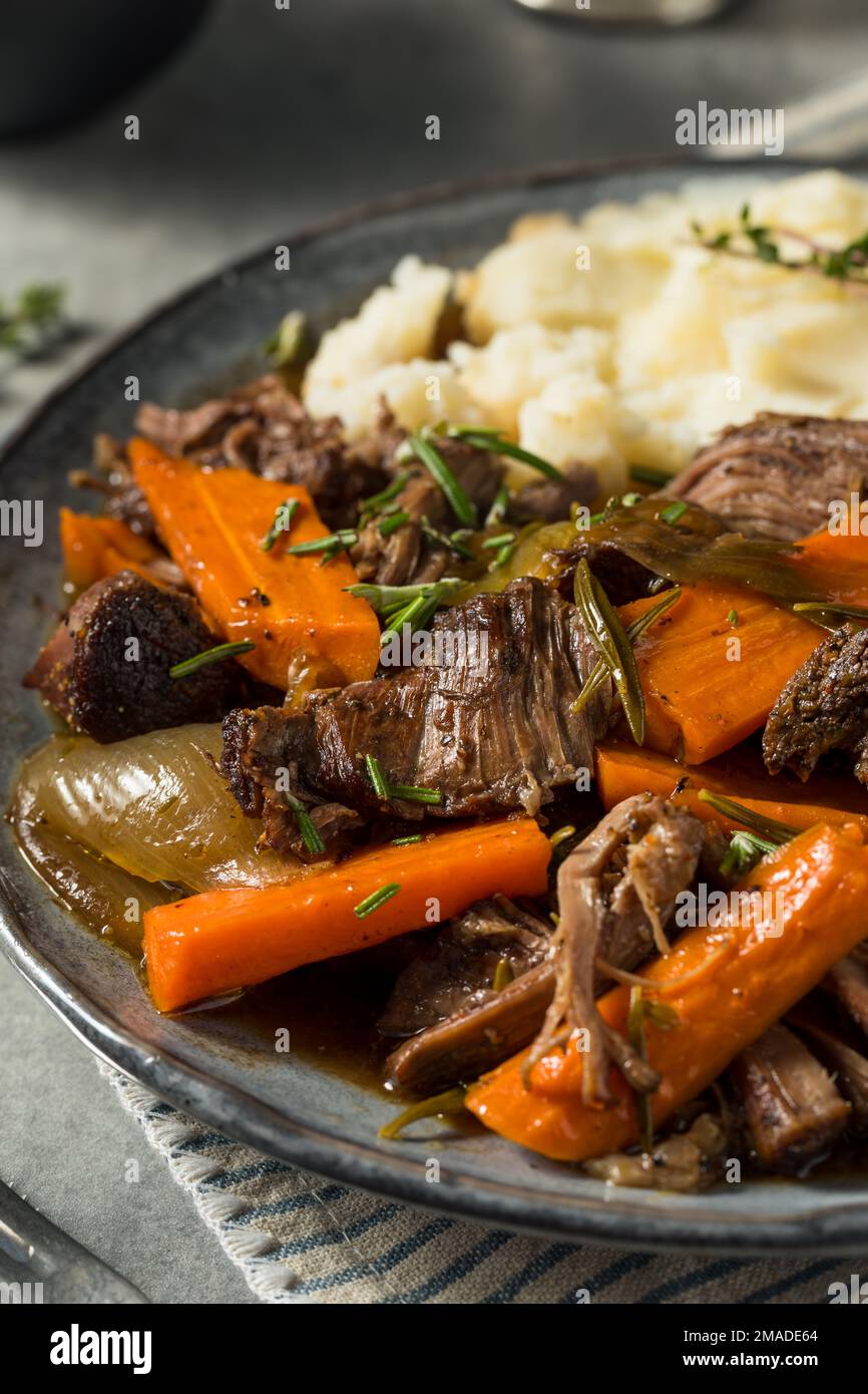 Homemade Beef Pot Roast with Carrots and Mashed Potatoes Stock Photo