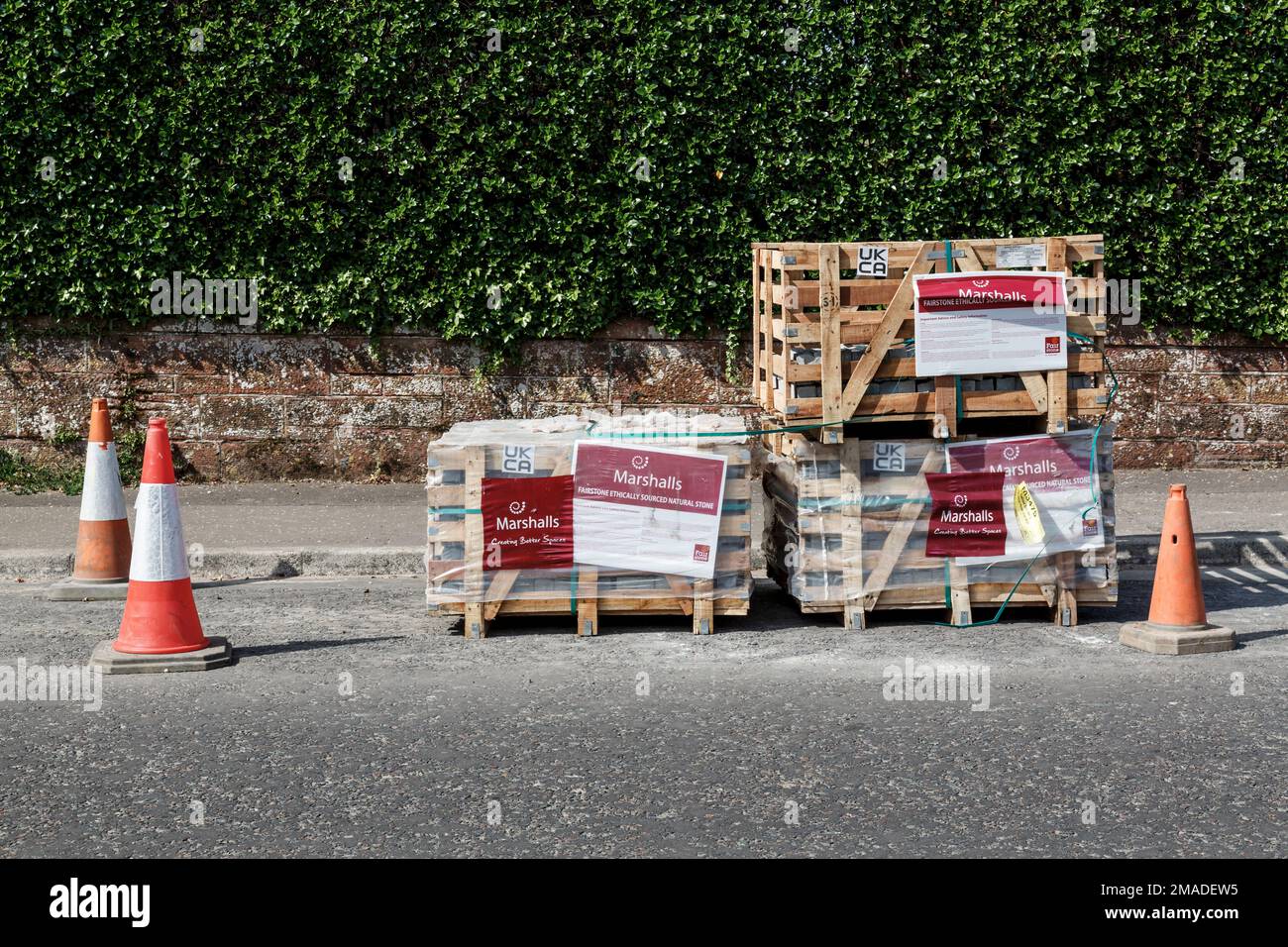 Marshalls landscaping materials in crates on a road, Scotland, UK, Europe Stock Photo