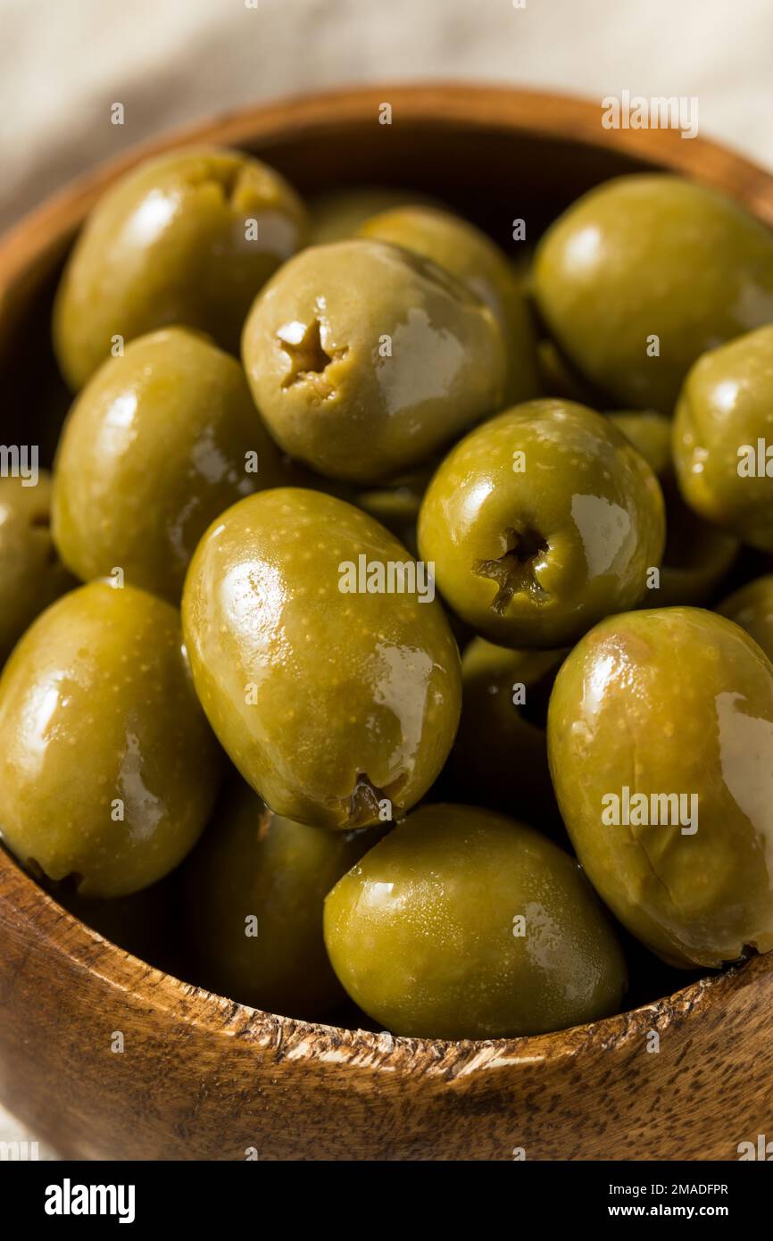 Raw Green Organic Marinated Olives in Oil Stock Photo Alamy