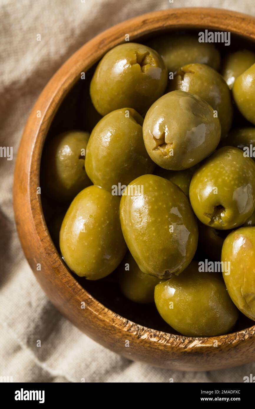 Raw Green Organic Marinated Olives in Oil Stock Photo Alamy