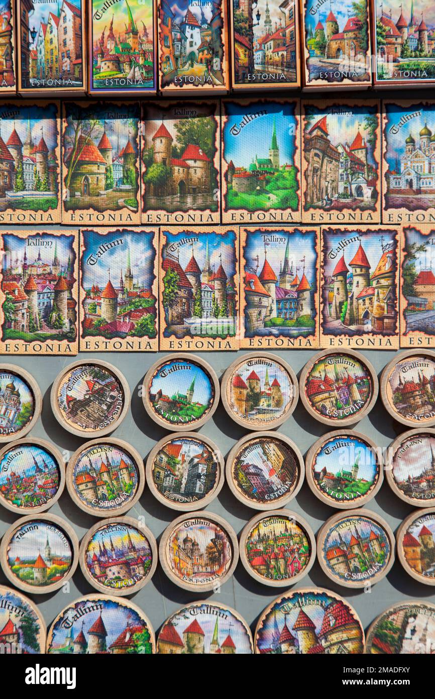 Estonia, Tallinn, tourist souvenirs, fridge magnets on market stall, depicting scenes of Tallinn. Stock Photo