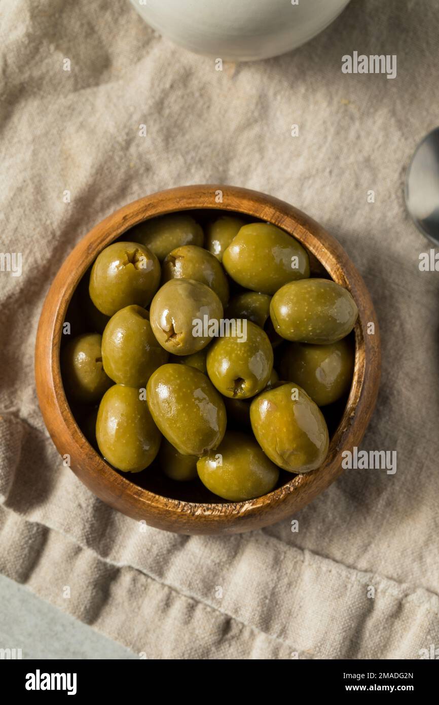 Raw Green Organic Marinated Olives in Oil Stock Photo Alamy