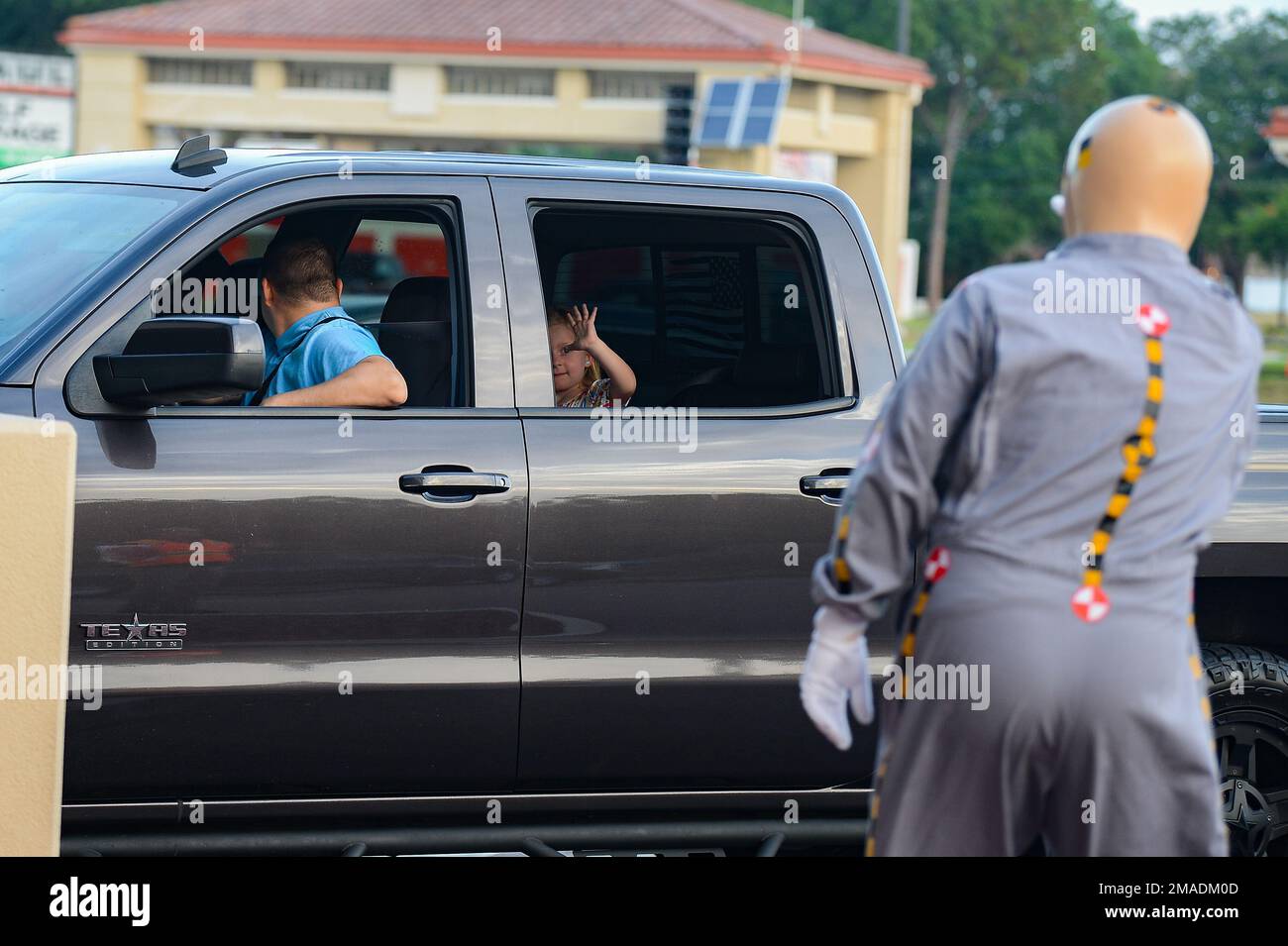 Jason Jackson, right, a member of 6th Air Refueling Safety, waves to an