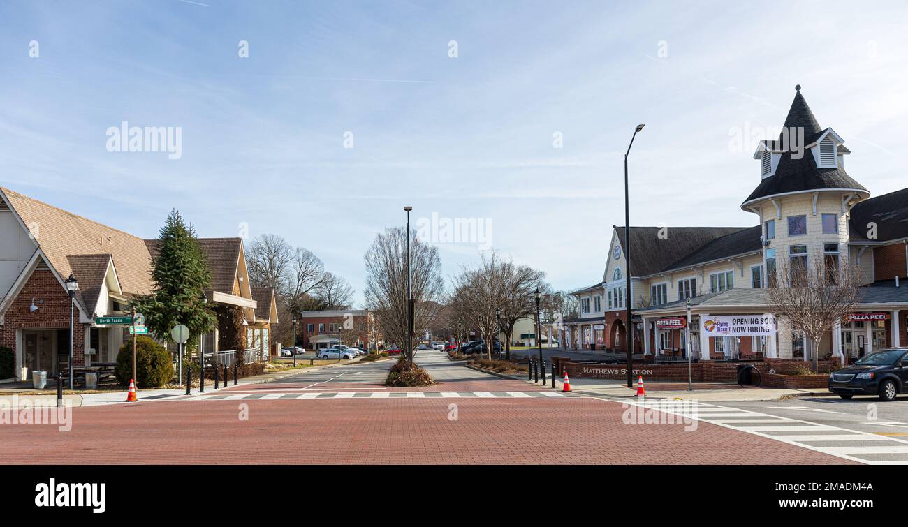MATTHEWS, NC, USA-15 JANUARY 2023: Wide angle view down Matthews Station Street.  Sunny, blue sky day. Stock Photo