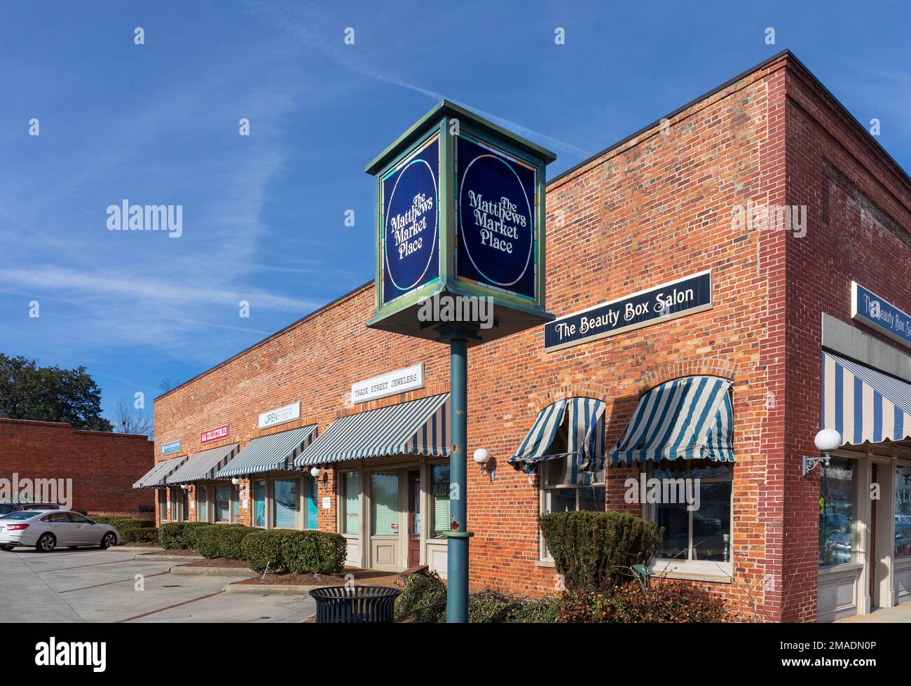 MATTHEWS, NC, USA-15 JANUARY 2023: The Matthews Market Place, building and signs.   Includes The Beauty Box Salon, Trade Street Jewelers, Open Fiiber, Stock Photo