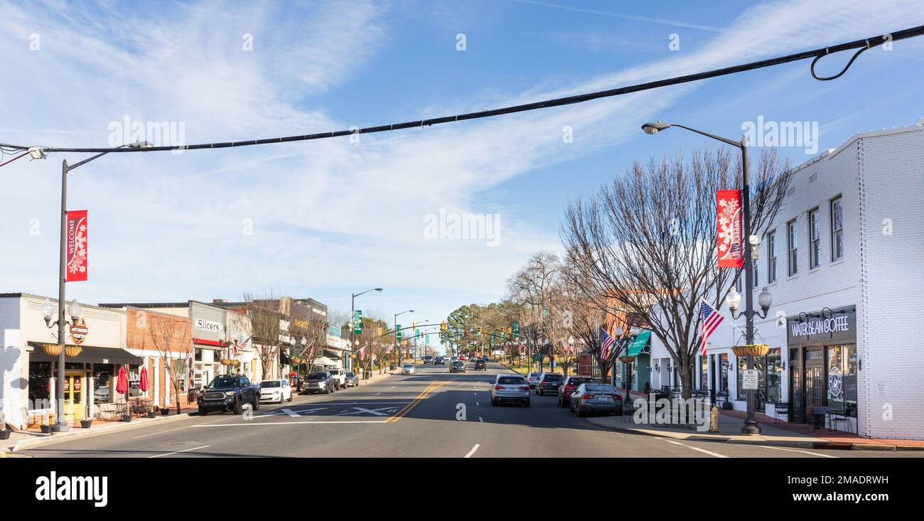 PINEVILLE, NC, USA-15 JANUARY 2023: Wide angle view up Main Street on blue sky, sunny winter day. Stock Photo