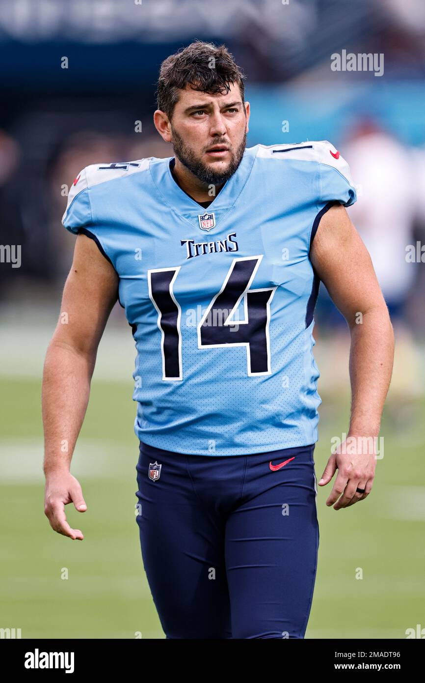 Tennessee Titans place kicker Randy Bullock (14) walks along the