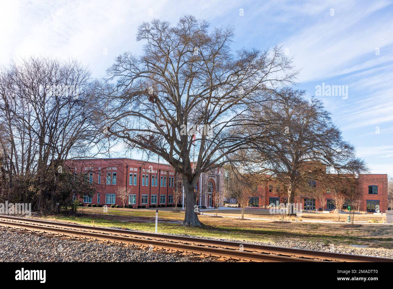 PINEVILLE, NC, USA-15 JANUARY 2023: Campus for the Pineville Police Department, Town Hall and Library.  Sunny, blue sky winter day. Stock Photo