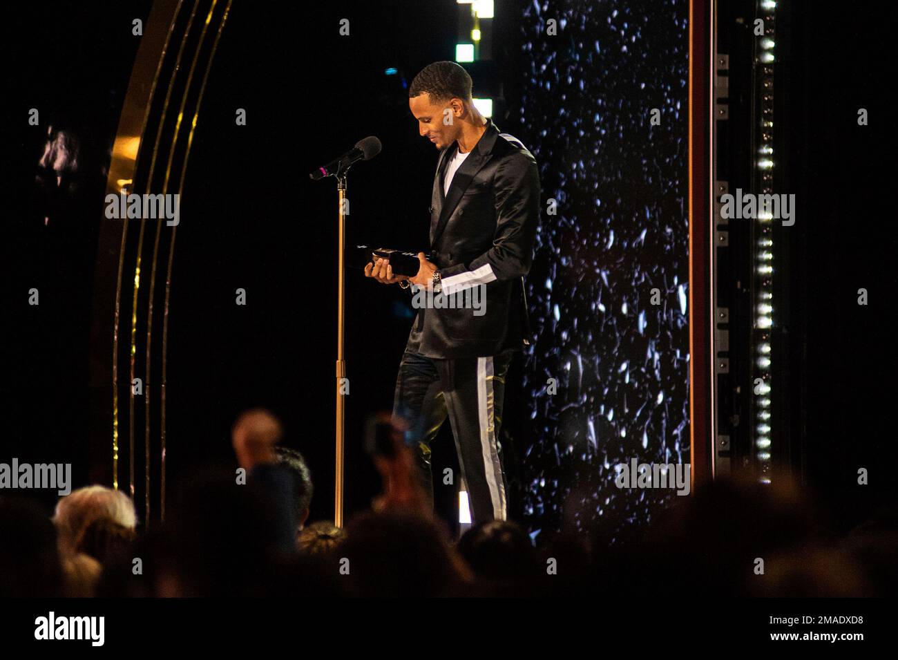 Canadian sprinter and six-time Olympic medallist Andre De Grasse holds ...