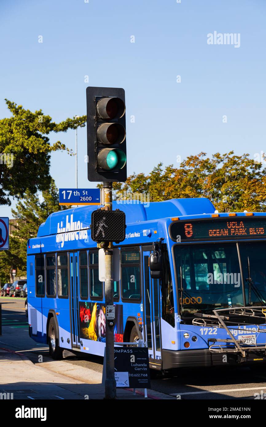 Big Blue Bus at green traffic light signal on Ocean Park Boulevard and 17th Street. Santa Monica, California, USA Stock Photo