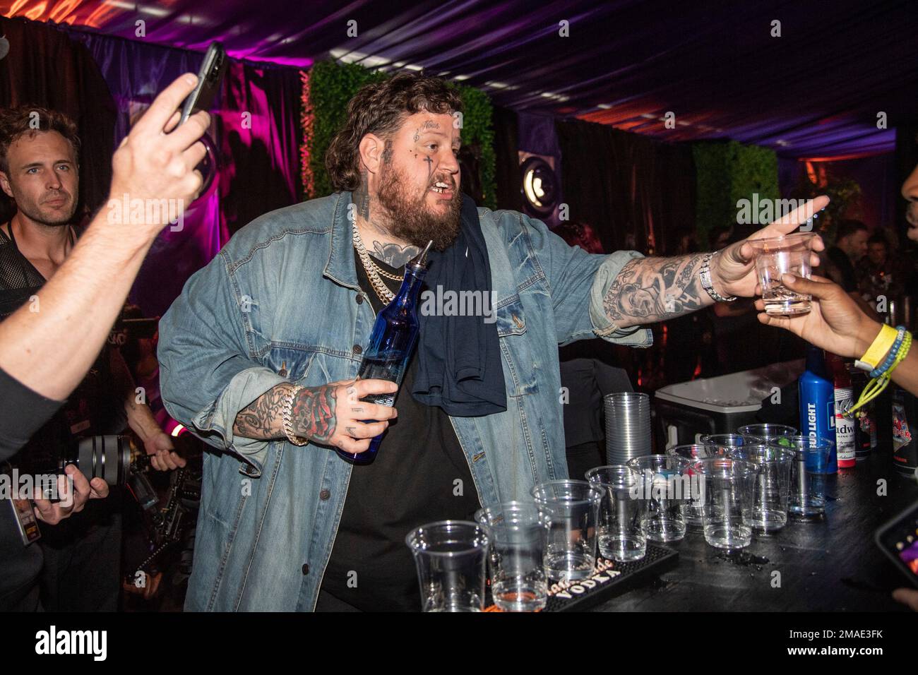 Jelly Roll is seen bartending at the Louder Than Life Music Festival at