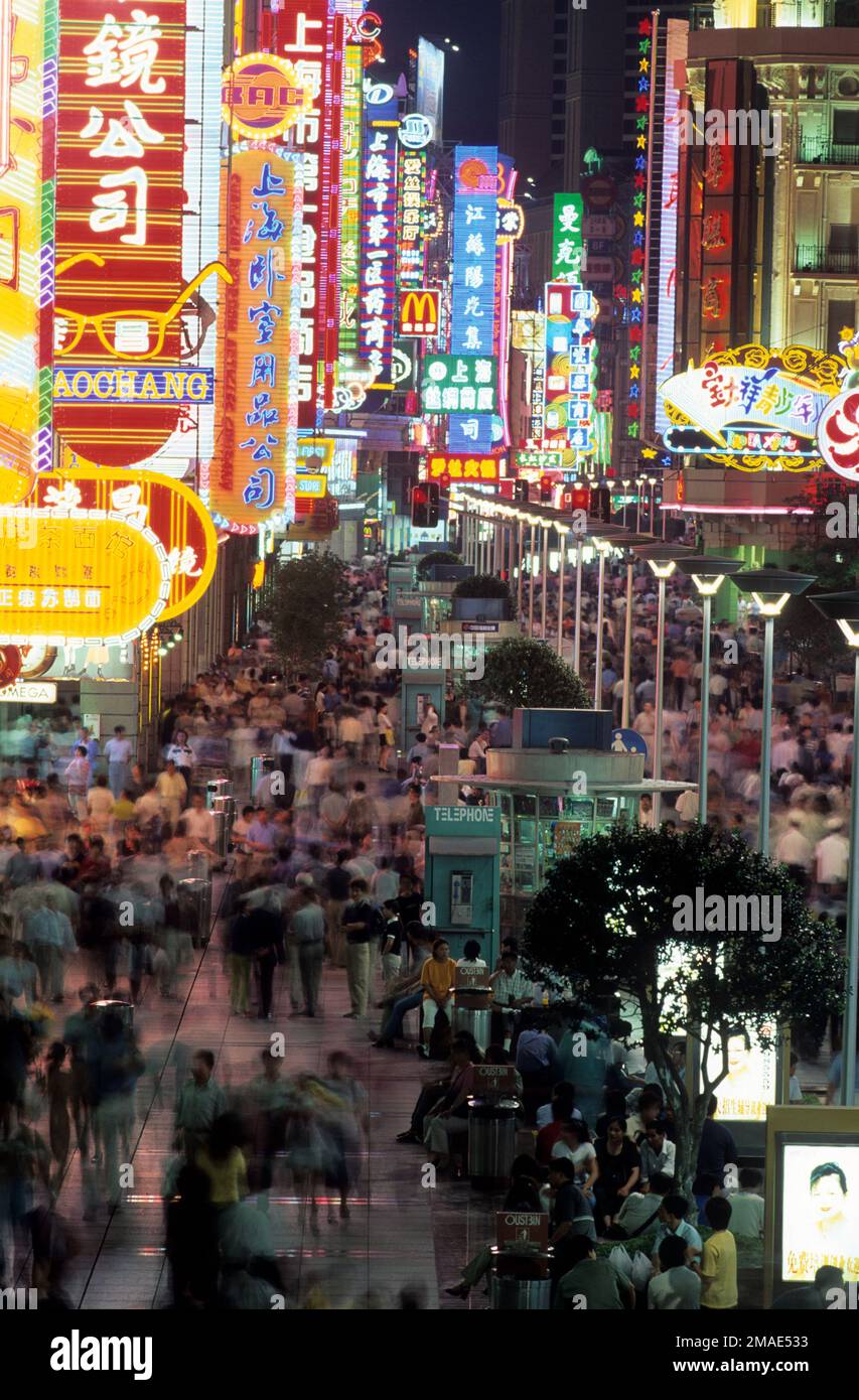 China, Shanghai, Nanjing Dong Lu or Nanjing Road as seen at night with hordes of shoppers. Stock Photo
