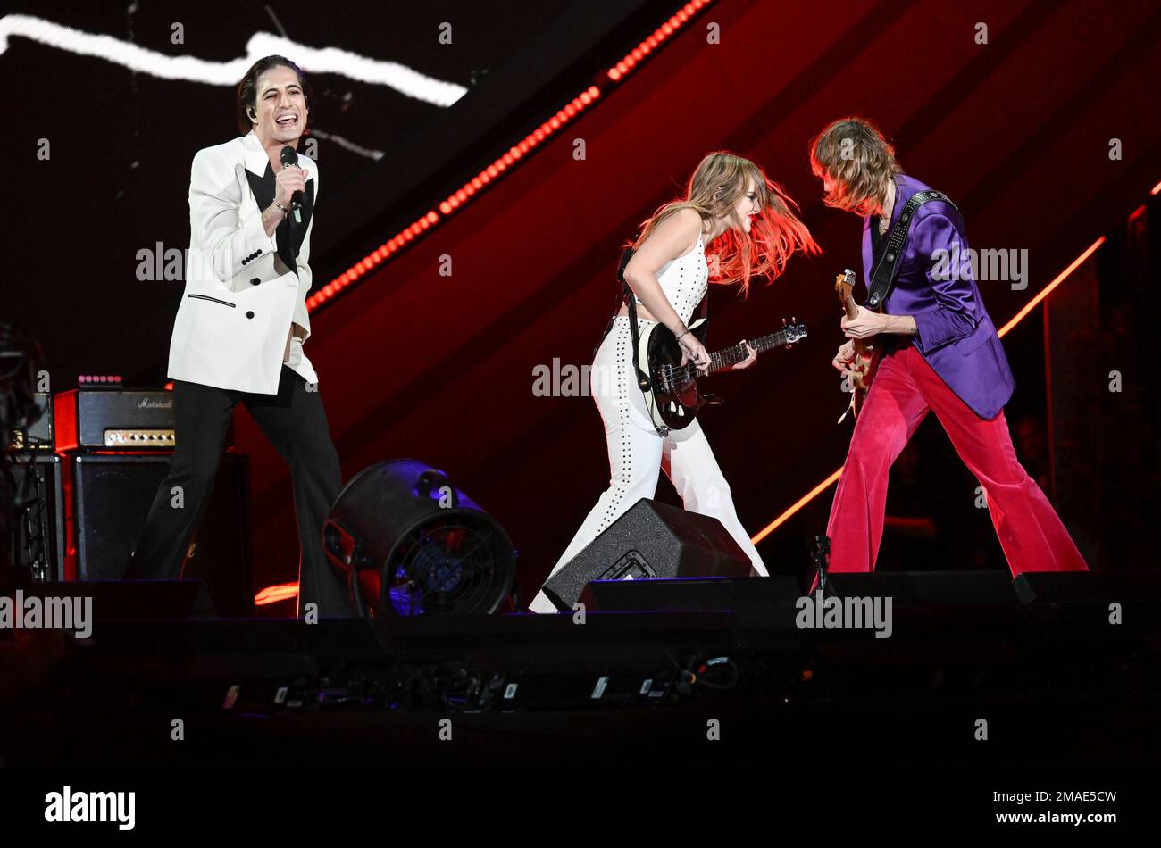 Damiano David, left, Victoria De Angelis and Thomas Raggi of Måneskin ...