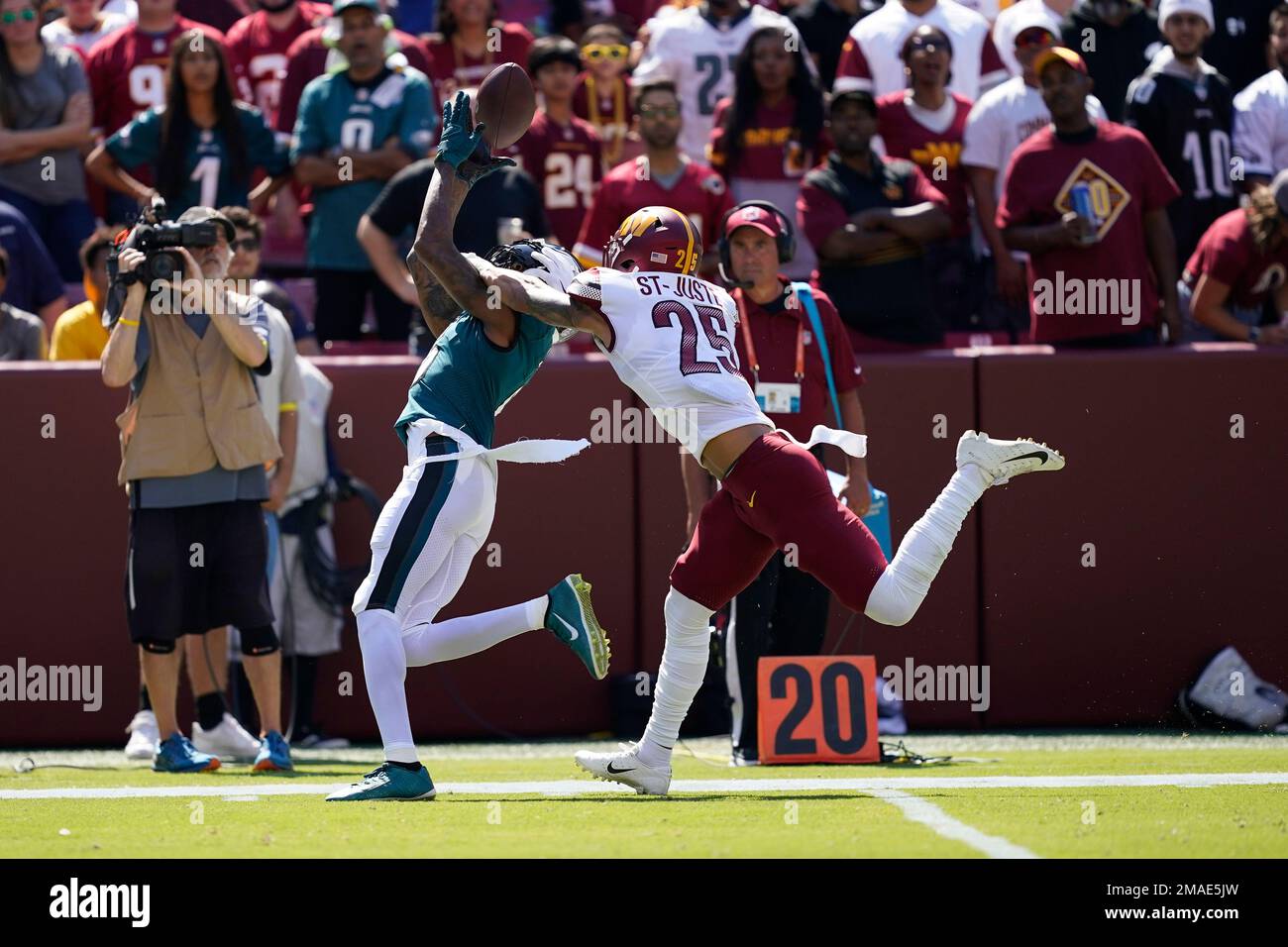 Philadelphia Eagles wide receiver DeVonta Smith (6) ,ales a catch against  Washington Commanders cornerback Benjamin St-Juste (25) during the first  half of an NFL football game, Sunday, Sept. 25, 2022, in Landover