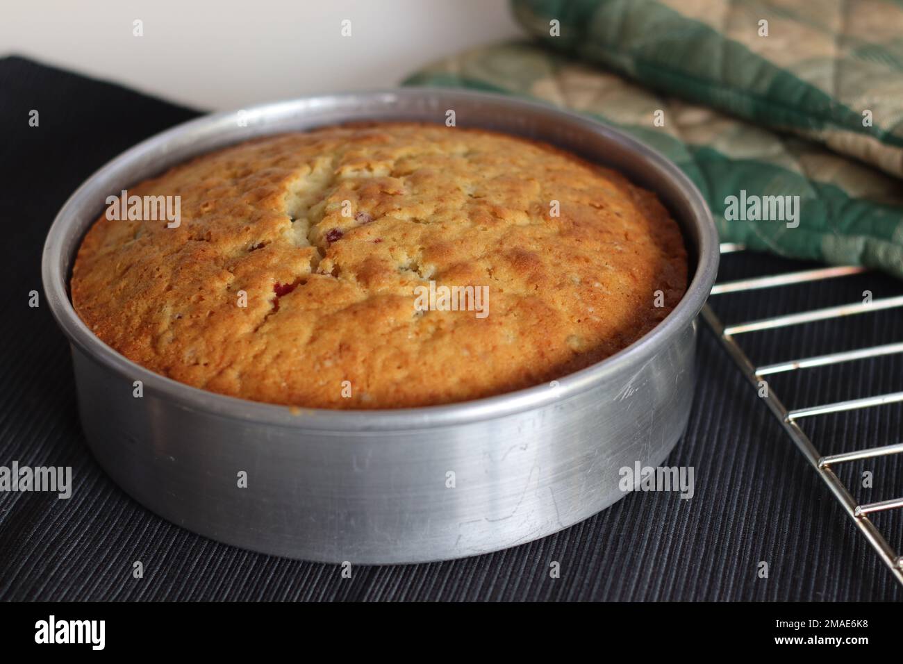 Tutti fruiti butter milk cake inside the baking tin. Tutti frutti cake