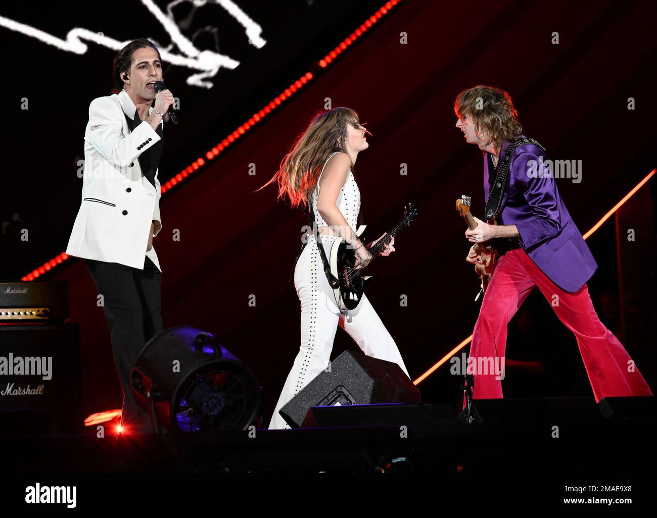 Damiano David, left, Victoria De Angelis and Thomas Raggi of Måneskin ...