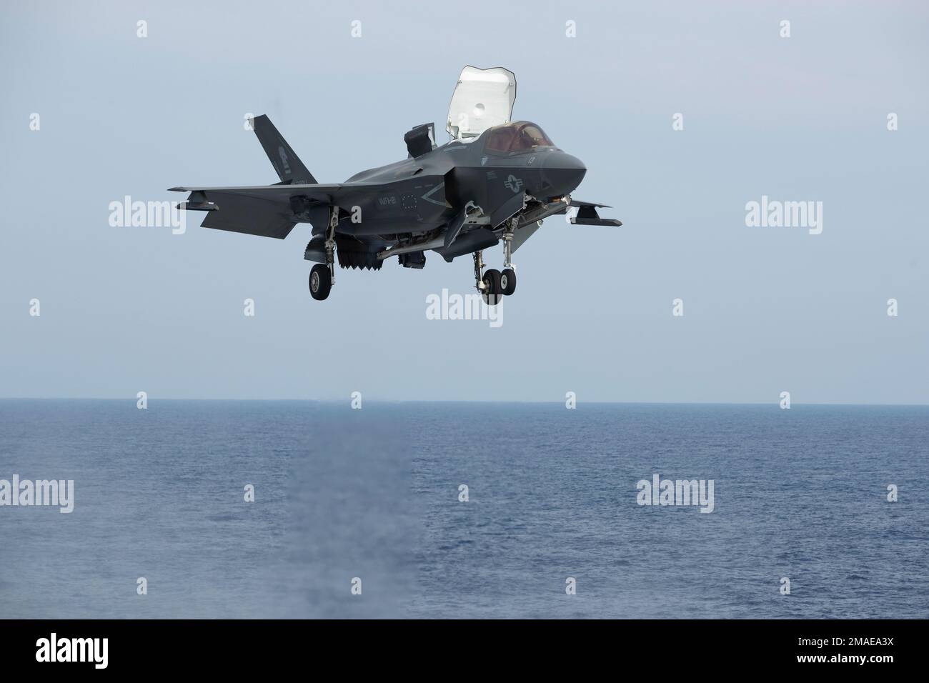 220527-XN177-1007 PACIFIC OCEAN (May 27, 2022) – An F-35B Lightning II aircraft assigned to Marine Fighter Attack Squadron (VMFA) 121 lands aboard amphibious assault carrier USS Tripoli (LHA 7), May 27, 2022. Tripoli is conducting routine operations in U.S. 7th Fleet. Stock Photo