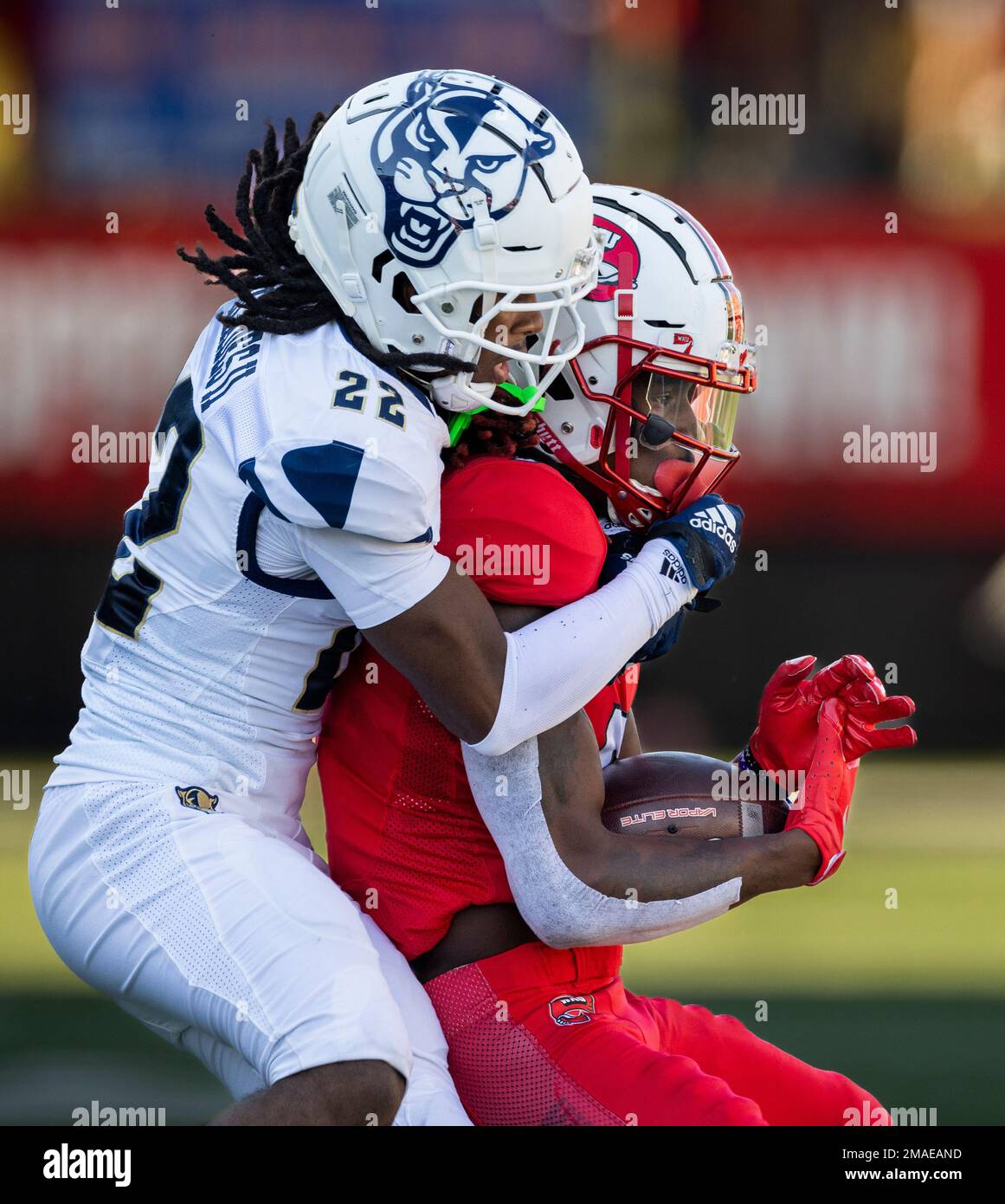 WKU wide receiver Daewood Davis, 7, gets tackled by defensive back 