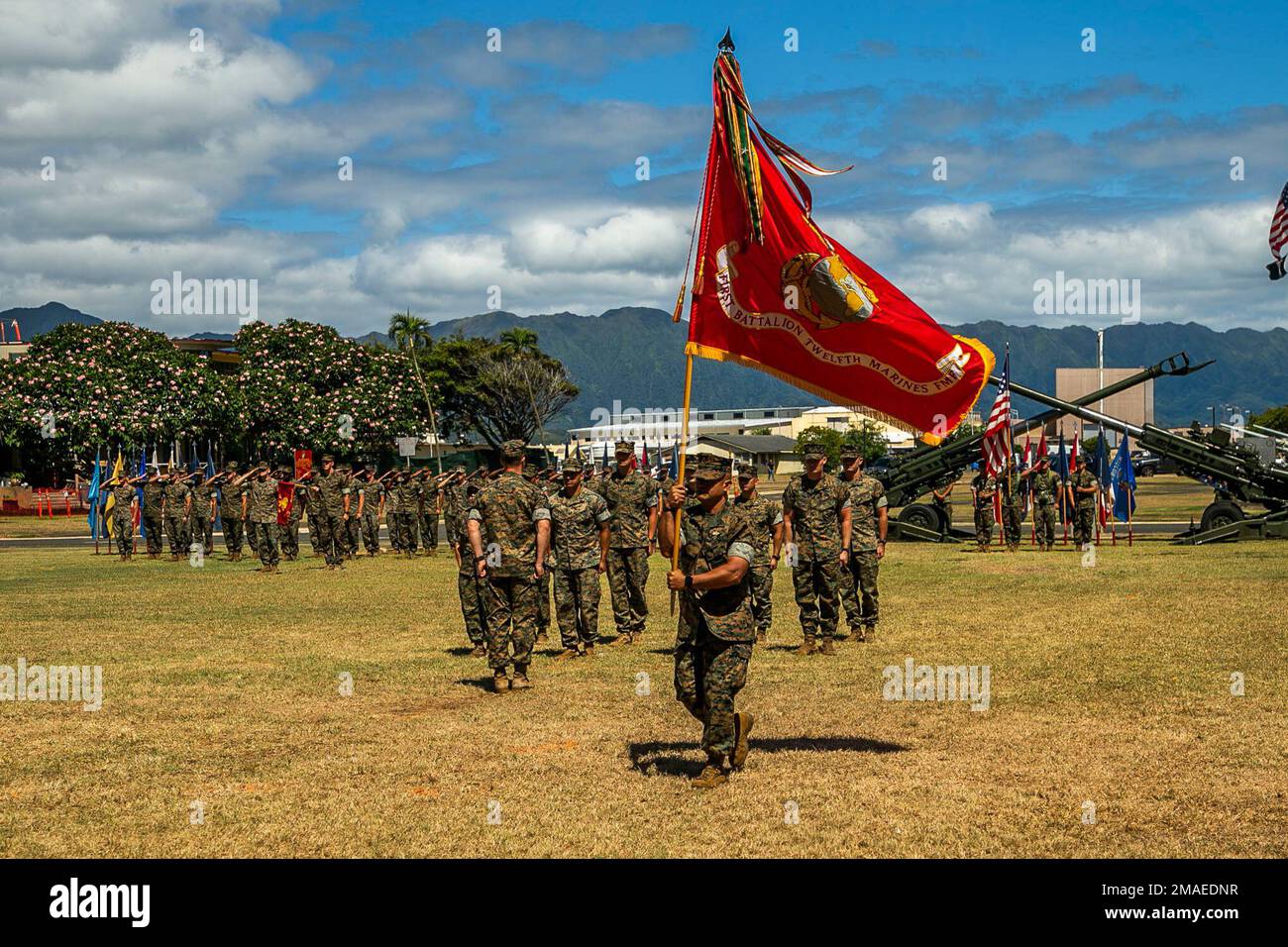 U.S. Marine Corps Sgt. Maj. Jose Romero, sergeant major, 1st Battalion, 12th Marine Regiment, delivers the colors during the unit’s change of command ceremony on Marine Corps Base Hawaii, May 26, 2022. LtCol. Richard Neikirk relinquished command of 1st Battalion, 12th Marines to Lt. Col. Joseph Gill II. Stock Photo