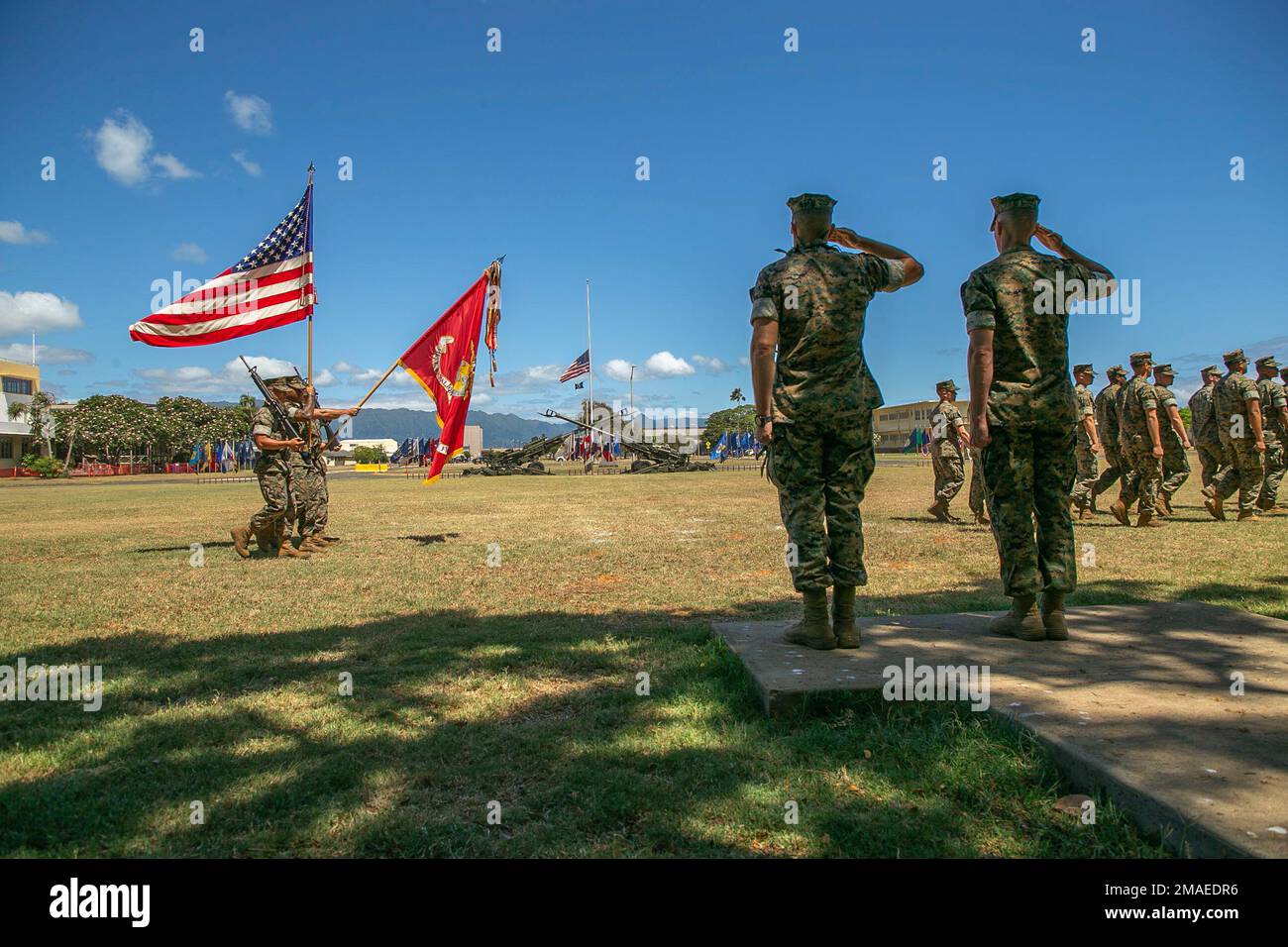U.S. Marine Corps Lt. Col. Richard Neikirk, outgoing commanding officer, and Lt. Col. Joseph Gill II, incoming commanding officer, 1st Battalion, 12th Marine Regiment, salute the colors during the unit’s change of command ceremony on Marine Corps Base Hawaii, May 26, 2022. LtCol. Neikirk relinquished command of 1st Battalion, 12th Marines to Lt. Col. Gill II. Stock Photo