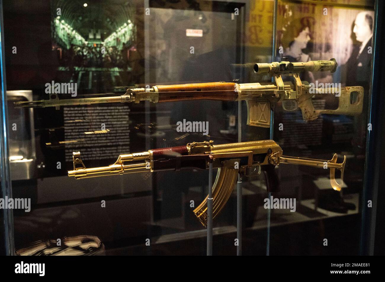 A gold AK-47 that belonged to Saddam Hussein along with an Iraqi sniper ...