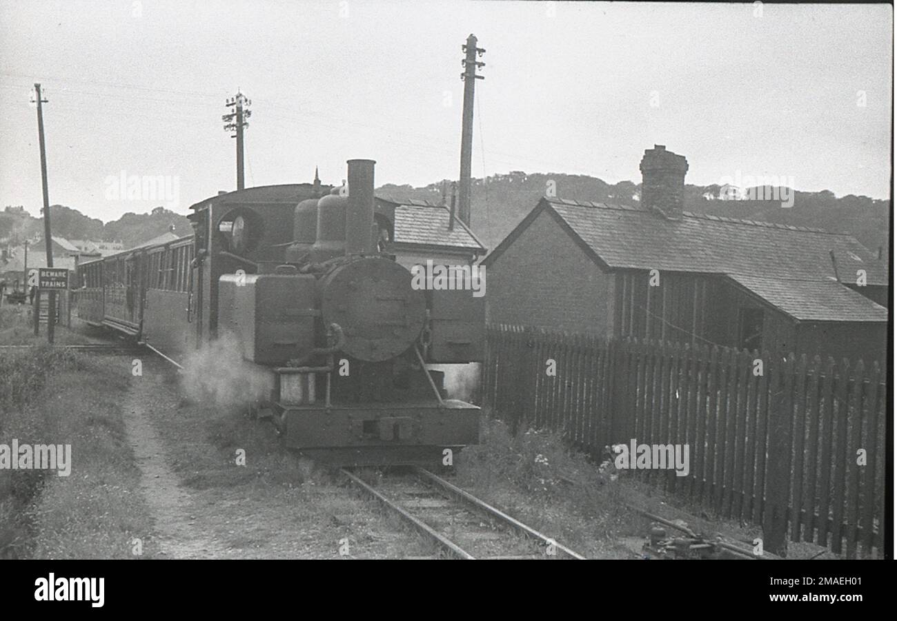 Welsh Highland Railway Baldwin 4-6-0T locomotive No. 590  is alongside Gelerts Farm. Stock Photo
