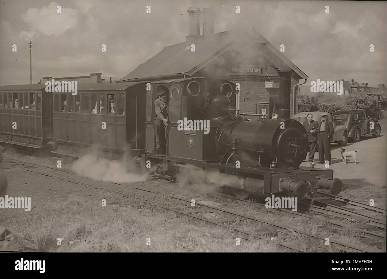 Talyllyn Railway locomotive No.2 Dolgoch on a train at Wharf Station Towyn with Jim Maxwell driving Stock Photo