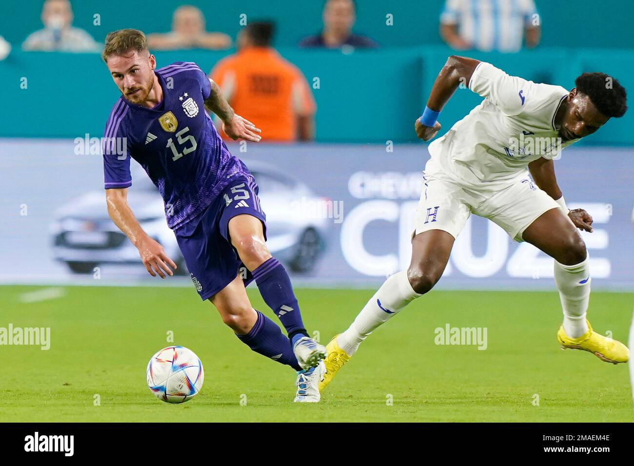 Argentina midfielder Alexis Mac Allister (15) takes the ball past