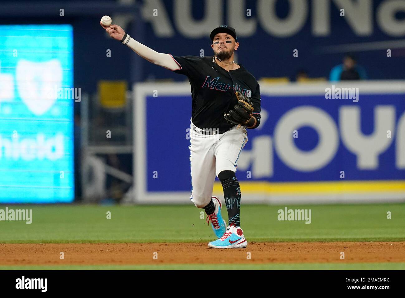 Miami Marlins shortstop Miguel Rojas (11) throws to first base on a hit