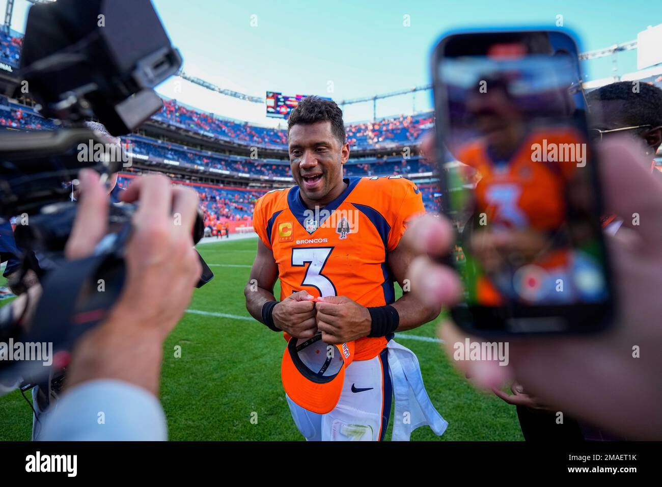 Denver Broncos quarterback Russell Wilson (3) leaves the field ...