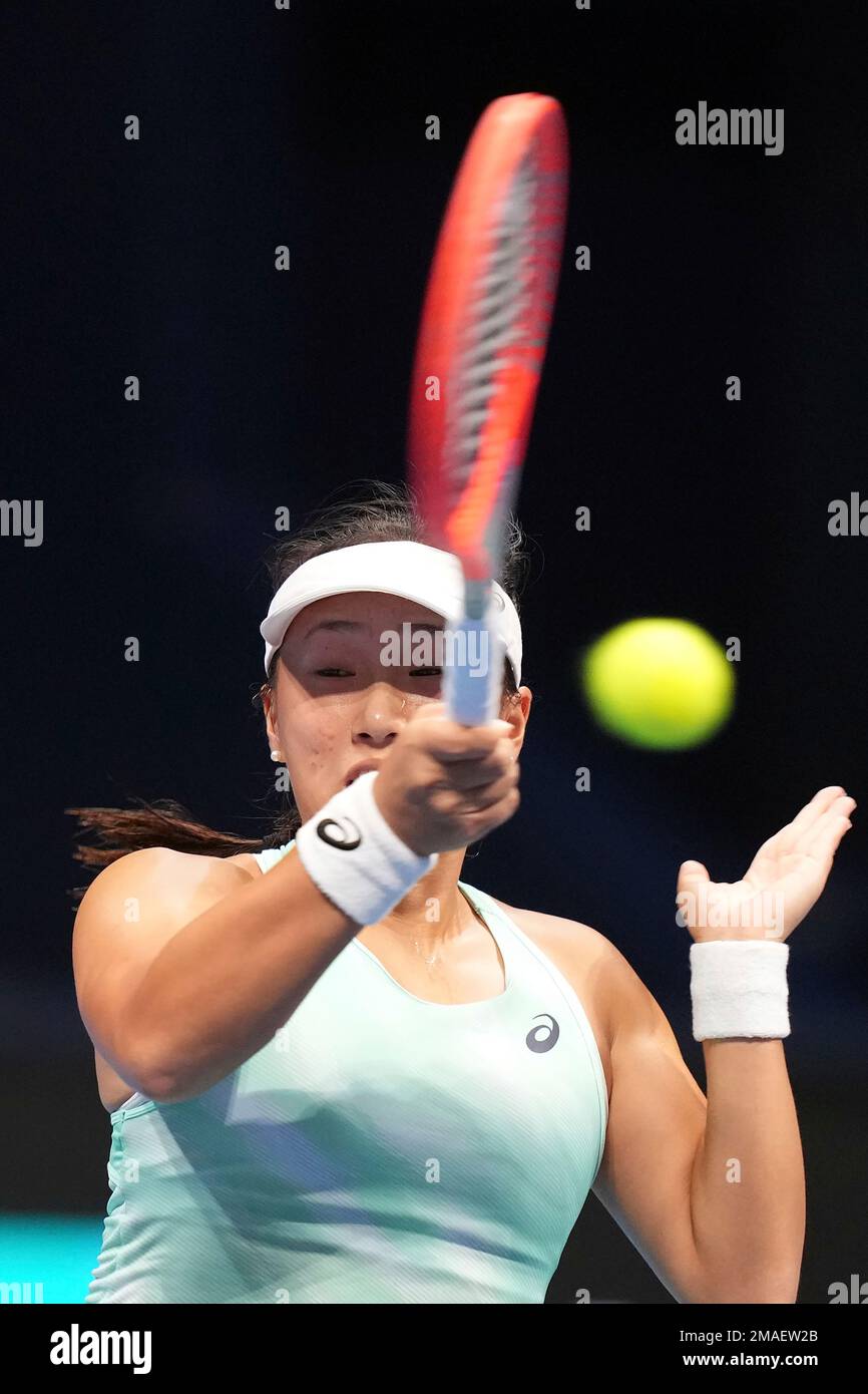 Claire Liu of the U.S. returns a shot against Zheng